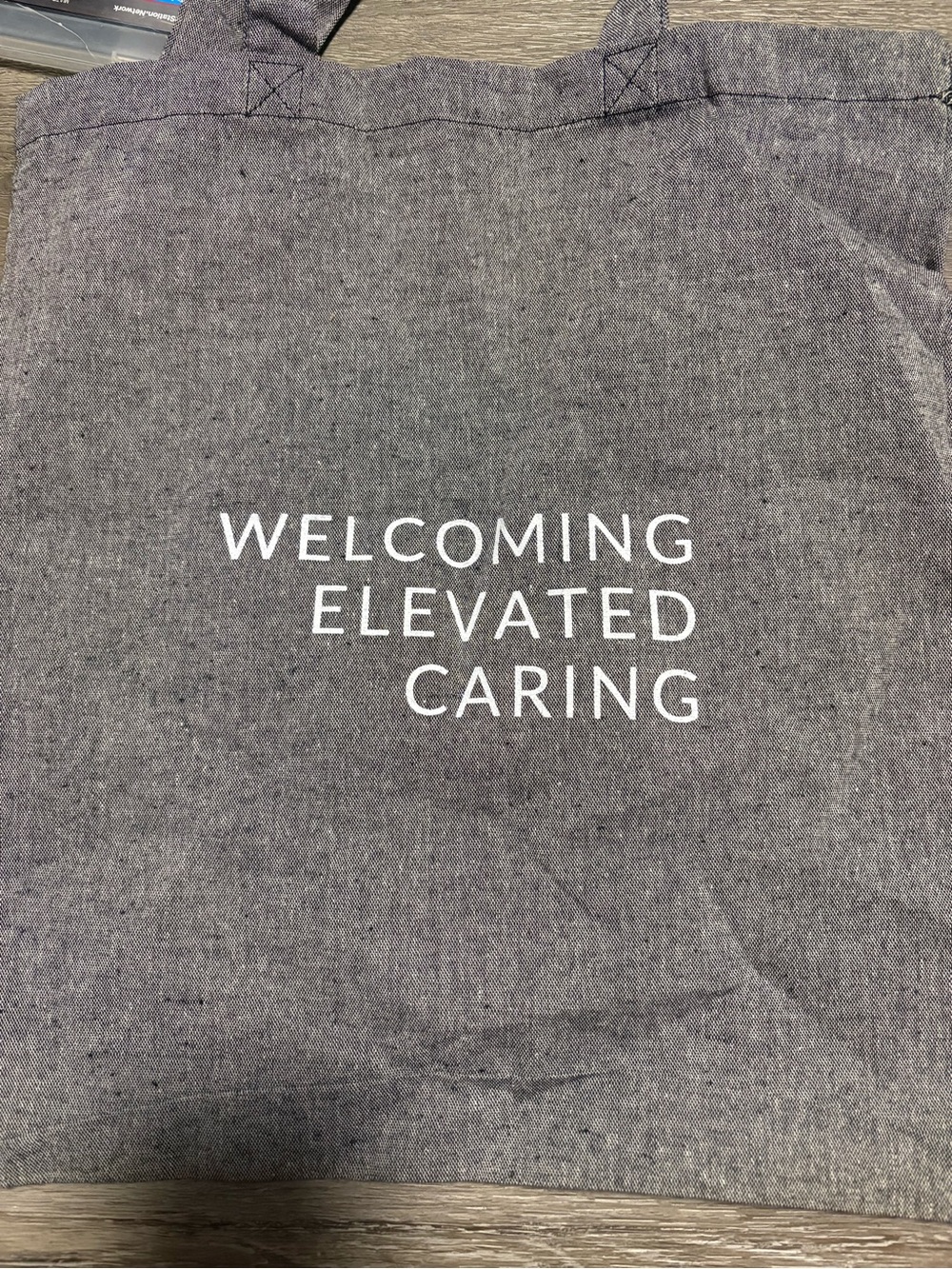 Delta Airlines Grey Canvas Tote with White Slogan - 'Welcoming Elevated Caring'